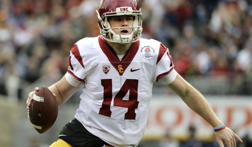 FILE - In this Jan. 2, 2017, file photo, Southern California quarterback Sam Darnold looks to pass against Penn State during the Rose Bowl NCAA college football game in Pasadena, Calif. Southern California and Washington are the strong favorites to win their respective Pac-12 divisions. (AP Photo/Jae C. Hong, File)