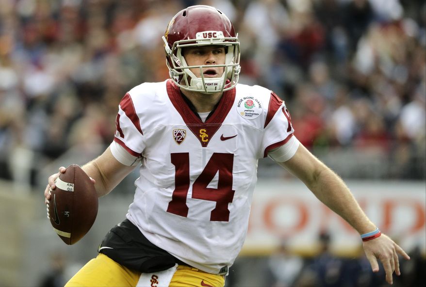 FILE - In this Jan. 2, 2017, file photo, Southern California quarterback Sam Darnold looks to pass against Penn State during the Rose Bowl NCAA college football game in Pasadena, Calif. Southern California and Washington are the strong favorites to win their respective Pac-12 divisions. (AP Photo/Jae C. Hong, File)