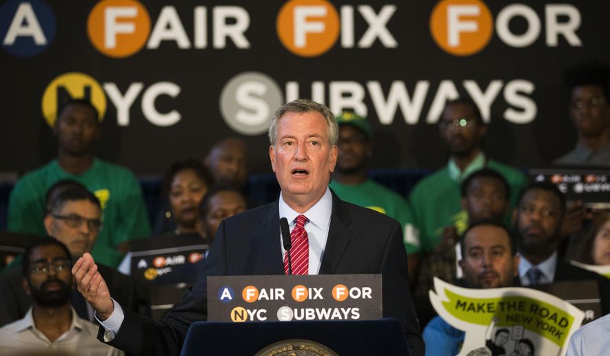 New York Mayor Bill de Blasio speaks at a rally where he announces a plan to fund MTA improvements on Monday, Aug. 7, 2017, in New York. De Blasio wants to tax the wealthiest 1 percent of city residents to fund repairs and improvements to the nation's largest subway system. (AP Photo/Michael Noble Jr.)