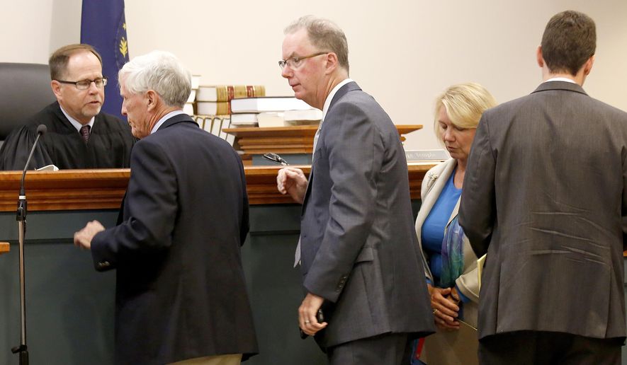 Hillsborough County Superior Court Judge Charles Temple, left, looks on after a sidebar breaks up with with Attorney Paul Twomey, second left, Attorney William Christie, Associate Attorney General Anne Edwards, and Assistant Attorney General Francis Fredericks, right, Monday, Aug. 7, 2017, in Hillsborough Superior Court in Nashua, N.H., on a lawsuit that would prevent the state from sending voter information to President Donald Trump's commission investigating election fraud. (AP Photo/Mary Schwalm, Pool)