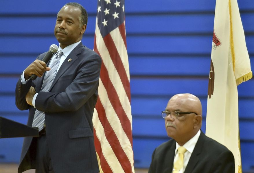 U.S. Secretary Secretary of Housing and Urban Development Ben Carson, right, accompanied by Cairo Mayor Tyrone Coleman, listens to questions during a a public forum Tuesday Aug. 8, 2017, at the Cairo Junior/Senior High School Gymnasium in Cairo, Ill. (Richard Sitler /The Southern Illinoisan via AP)