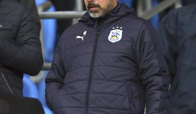 FILE - In this Wednesday, March 1, 2017 file photo, Huddersfield&#39;s team manager David Wagner in the stands for the English FA Cup soccer match between Manchester City and Huddersfield Town at the Etihad stadium in Manchester, England.  German-born former U.S. international, Wagner has admitted to considering moving on from Huddersfield having taken the West Yorkshire club from the brink of relegation to England’s top tier in just over 18 months, and has now signed a contract keeping him with the club until 2019. (AP Photo/Dave Thompson, file)