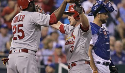 St. Louis Cardinals&#x27; Jedd Gyorko (3) celebrates with Dexter Fowler (25) after hitting a three-run home run during the fifth inning of a baseball game against the Kansas City Royals, Tuesday, Aug. 8, 2017, in Kansas City, Mo. (AP Photo/Charlie Riedel)