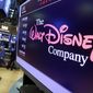 In this Monday, Aug. 7, 2017, photo, The Walt Disney Co. logo appears on a screen above the floor of the New York Stock Exchange. The Walt Disney Co. reports earnings, Tuesday, Aug. 8, 2017. (AP Photo/Richard Drew)