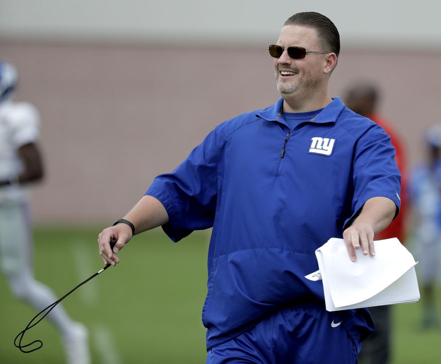 New York Giants head coach Ben McAdoo reacts after a play during NFL football training camp, Tuesday, Aug. 8, 2017, in East Rutherford, N.J. (AP Photo/Julio Cortez)