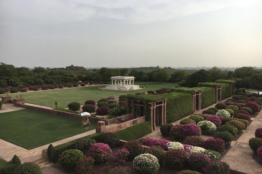 This Wednesday, June 26, 2017 photo shows a general view of the Umaid Bhawan Palace gardens in Jodhpur, India. In the summer of 1944, hundreds of royals gathered for the opening of Umaid Bhawan Palace, a magnificent sandstone edifice that dominates the skyline in India&#39;s northwestern city of Jodhpur. It was the last of its kind. Three years later, India was free from British colonial rule, and more than 500 princely states — the semi-sovereign principalities ruled by royal clans — faced an uncertain future. Most have faded into obscurity, but the family that built this palace continues to thrive — in part by converting a section of it into a hotel. (AP Photo/Vineeta Deepak)