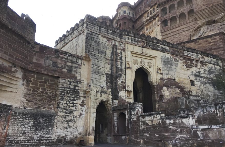 This Wednesday, June 26, 2017 photo shows the entrance of the Mehrangarh Fort in Jodhpur, India. The last reigning maharaja's grandson, Gaj Singh, was only 4 when his father died in a plane crash in 1952, making him sole owner of the Umaid Bhawan Palace and other family properties, including the ancestral Mehrangarh Fort. (AP Photo/Vineeta Deepak)
