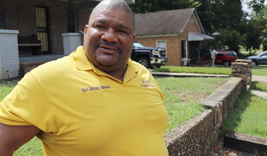 The Rev. Benny Johnson, of the Arkansas Stop the Violence movement, prepares for a news conference in Little Rock, Ark., on Tuesday, Aug. 8, 2017, near the home of a man killed early Sunday in a home-invasion robbery. Arkansas' capital city has seen 39 homicides so far in 2017. (AP Photo/Kelly P. Kissel)