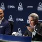 PGA Tour commissioner Jay Monahan speaks as Peter Bevacqua, CEO of the PGA of America, listens during a news conference at the PGA Championship golf tournament at the Quail Hollow Club Tuesday, Aug. 8, 2017, in Charlotte, N.C. (AP Photo/Chris Carlson)