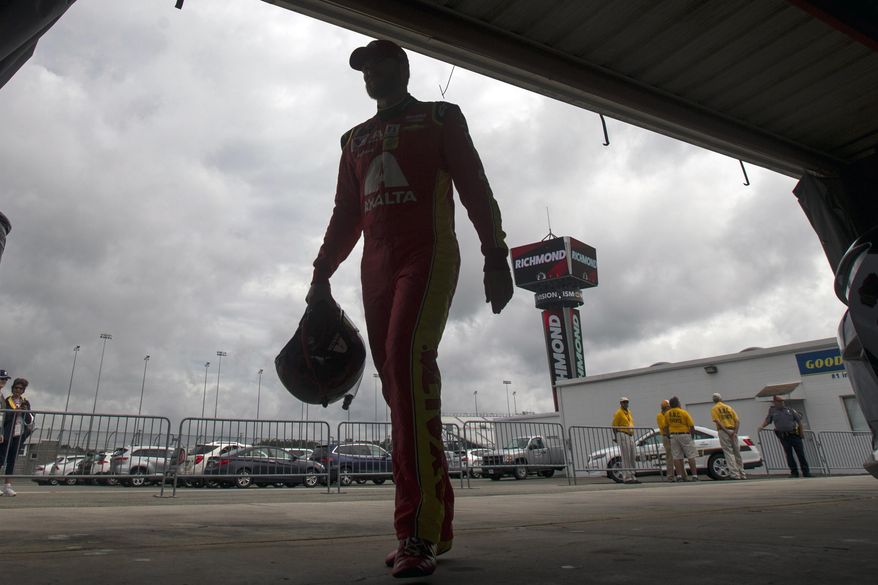 NASCAR driver Dale Earnhardt Jr., who is a big Washington Redskins fan Redskins fan, gets ready for the Redskins players to show up, Tuesday Aug. 8, 2017 in Richmond, Va. (Shaban Athuman/Richmond Times-Dispatch via AP)