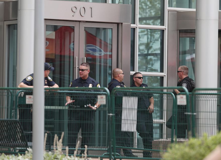 Officers stand guard outside the main entrance to the federal courthouse during a civil trial involving former radio host David Mueller and pop singer Taylor Swift, Tuesday, Aug. 8, 2017, in Denver. Swift alleges that Mueller touched her during a concert meet-and-greet in 2013. The case went to court after Mueller sued Swift, claiming her false accusation cost him his job. He is seeking at least $3 million in damages. Swift countersued, claiming sexual assault. (AP Photo/David Zalubowski)