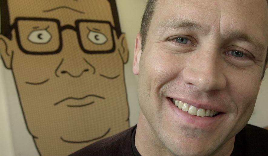 Mike Judge, co-creator of the Fox cartoon series &quot;King of the Hill,&quot; poses in front of an illustration of Hank Hill,  the animated character he voices, in Los Angeles on Oct. 28, 2002. (Associated Press) **FILE**