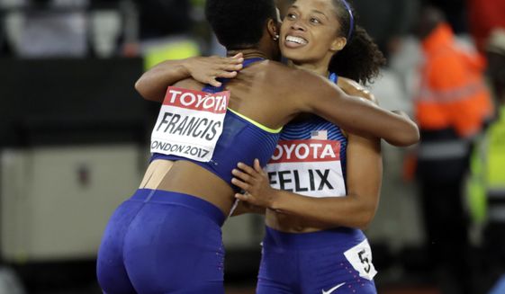 United States&#39; bronze medal winner Allyson Felix, right, congratulates United States&#39; gold medal winner Phyllis Francis, left, after the women&#39;s 400-meter final during the World Athletics Championships in London Wednesday, Aug. 9, 2017. (AP Photo/Matthias Schrader)