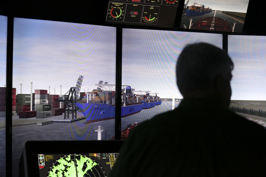 FOR USE SUNDAY AUG. 13, 2017, OR THEREAFTER-Captain Thomas Goodwin monitors the ship consoles as the large oil tanker is entering a narrow part of the channel during a training simulator exercise at San Jacinto College Maritime Wednesday, Aug. 2, 2017, in La Porte. The simulators are used to prepare for larger ships that are expected to call on the Port of Houston. ( Yi-Chin Lee /Houston Chronicle via AP)