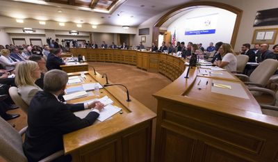 The Assembly Committee on Jobs and Economy meets about the incentive deal for Taiwan-based Foxconn Technology Group, Thursday, Aug. 3, 2017, at the state Capitol in Madison, Wis. The company last week that it planned to construct the first liquid crystal display panel factory outside of Asia in southeast Wisconsin. The deal requires the state to approve $3 billion in tax breaks tied to Foxconn hiring and spending as promised.  (Mark Hoffman/Milwaukee Journal-Sentinel via AP)