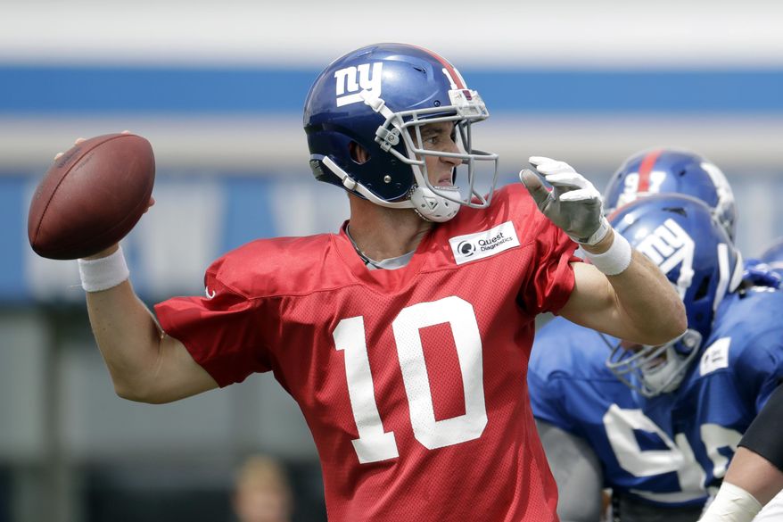 New York Giants quarterback Eli Manning looks to pass during NFL football training camp, Tuesday, Aug. 8, 2017, in East Rutherford, N.J. (AP Photo/Julio Cortez)
