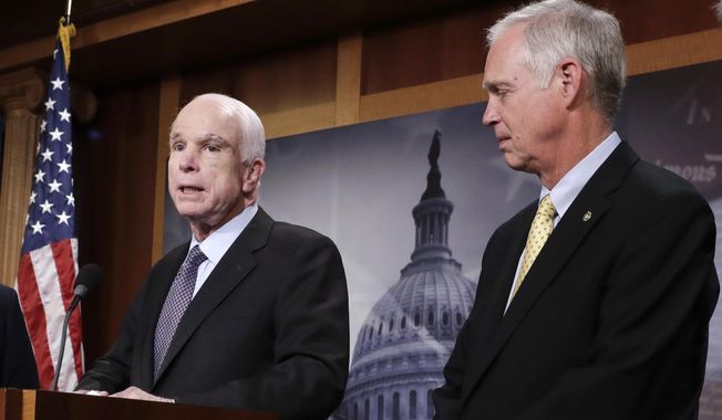 In this July 27, 2017 file photo, Sen. Ron Johnson, R-Wis. listens as Sen. John McCain, R-Ariz. speaks on Capitol Hill in Washington.  Johnson suggested that John McCain&#x27;s brain tumor and the after-midnight timing of the vote were factors in the Arizona lawmaker&#x27;s decisive vote against the GOP health care bill. In a radio interview, Johnson answered questions about the collapse of the years-long Republican effort to repeal and replace Barack Obama&#x27;s Affordable Care Act, his criticism of the process and McCain&#x27;s dramatic vote.  (AP Photo/J. Scott Applewhite)