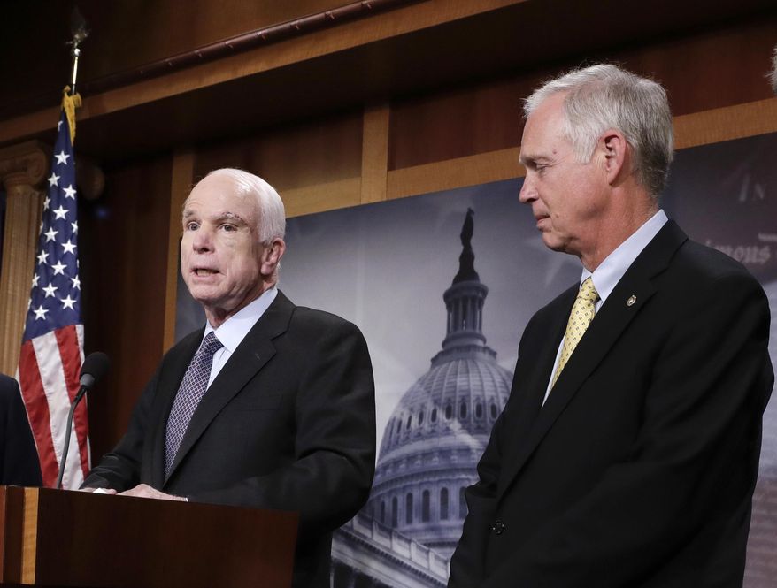 In this July 27, 2017 file photo, Sen. Ron Johnson, R-Wis. listens as Sen. John McCain, R-Ariz. speaks on Capitol Hill in Washington.  Johnson suggested that John McCain&#x27;s brain tumor and the after-midnight timing of the vote were factors in the Arizona lawmaker&#x27;s decisive vote against the GOP health care bill. In a radio interview, Johnson answered questions about the collapse of the years-long Republican effort to repeal and replace Barack Obama&#x27;s Affordable Care Act, his criticism of the process and McCain&#x27;s dramatic vote.  (AP Photo/J. Scott Applewhite)