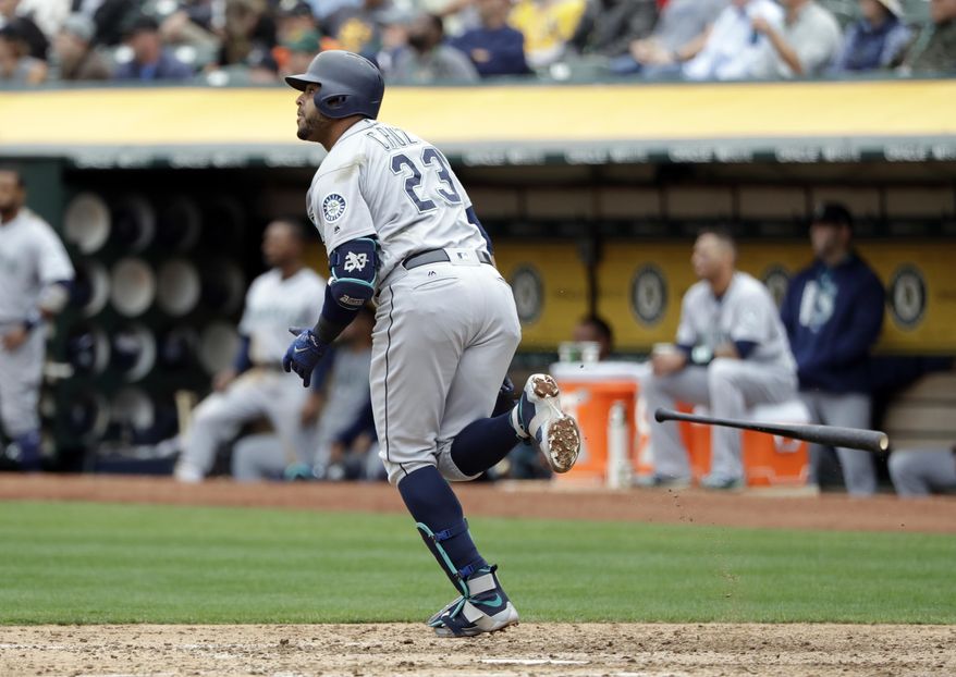 Seattle Mariners&#x27; Nelson Cruz drops his bat as he hits a solo home run against the Oakland Athletics during the fifth inning of a baseball game Wednesday, Aug. 9, 2017, in Oakland, Calif. (AP Photo/Marcio Jose Sanchez)