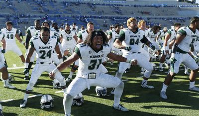 FILE - In this Oct. 22, 2016, file photo, Hawaii linebacker Jahlani Tavai leads his teammates in the team&#39;s traditional haka, or war cry, after defeating Air Force 34-27 in double overtime in an NCAA college football game at Air Force Academy, Colo. (AP Photo/David Zalubowski, File)