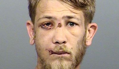 This photo provided by the Marion County Sheriff&#x27;s Office in Indianapolis shows Jason Brown, who has been charged with murder in the July 27, 2017, shooting death of Southport Police Lt. Aaron Allan in Indianapolis. Brown is scheduled for an initial court hearing Wednesday, Aug. 9, 2017. He has been hospitalized with multiple gunshot wounds after two officers fired on him following Allan&#x27;s shooting. (Marion County Sheriff&#x27;s Office via AP)
