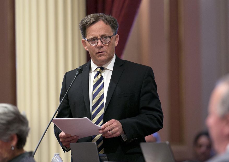 FILE -- In this June 15, 2017 file photo state Sen. Josh Newman, D-Fullerton, urges lawmakers to approve a measure to change the rules governing recall elections, at the Capitol, in Sacramento, Calif. Records show that an attorney for Senate Democrats spoke behind the scenes with Fair Political Practices Commission member Brian Hatch before the commission voted change a longstanding rule that restricts how much money Newman can raise from fellow lawmakers to fight a recall.(AP Photo/Rich Pedroncelli, file)