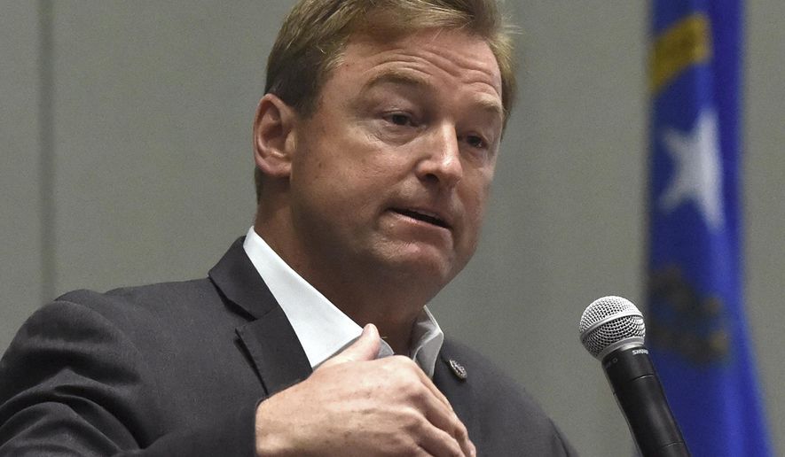 In this April 17, 2017, file photo, Nevada Sen. Dean Heller, R-Nev., answers a question during a town hall at the Reno Sparks Convention Center in Reno, Nev. (Andy Barron /The Reno Gazette-Journal via AP, File)