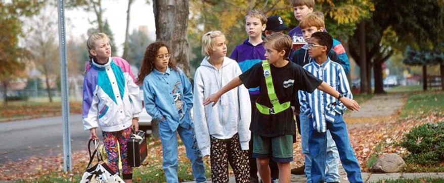 Getting students safely to and from school is a top priority. The AAA School Safety Patrol Program helps ensure that kids can do that. Ushers lead kids across intersections. (AAA)