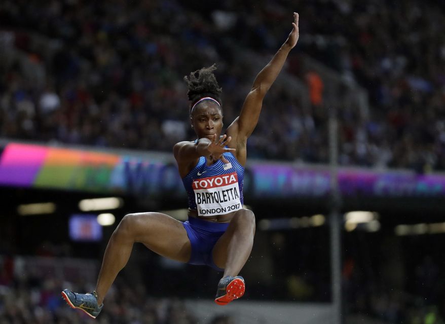 United States' Tianna Bartoletta makes an attempt in the women's long jump qualification during the World Athletics Championships in London Wednesday, Aug. 9, 2017. (AP Photo/Matt Dunham)
