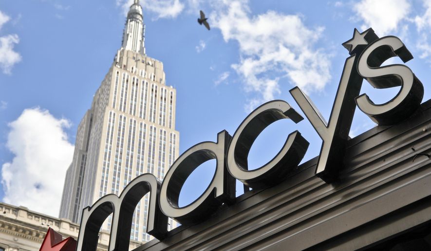 This Tuesday, May 2, 2017, photo shows Macy's corporate signage at its flagship store in New York. Macy's Inc. reports earnings, Thursday, Aug. 10, 2017. (AP Photo/Bebeto Matthews)
