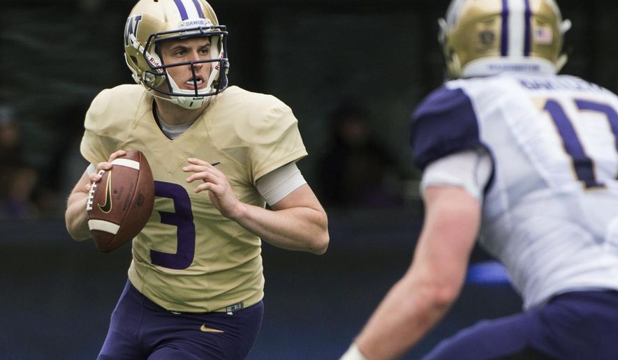 FILE - In this April 22, 2017, file photo, Washington quarterback Jake Browning (3) looks to pass during the NCAA college football team's spring game at Husky Stadium, in Seattle. It took Chris Petersen all of three years to put Washington back in the national conversation. Now, stay there. (Joshua Bessex/The News Tribune via AP, File)