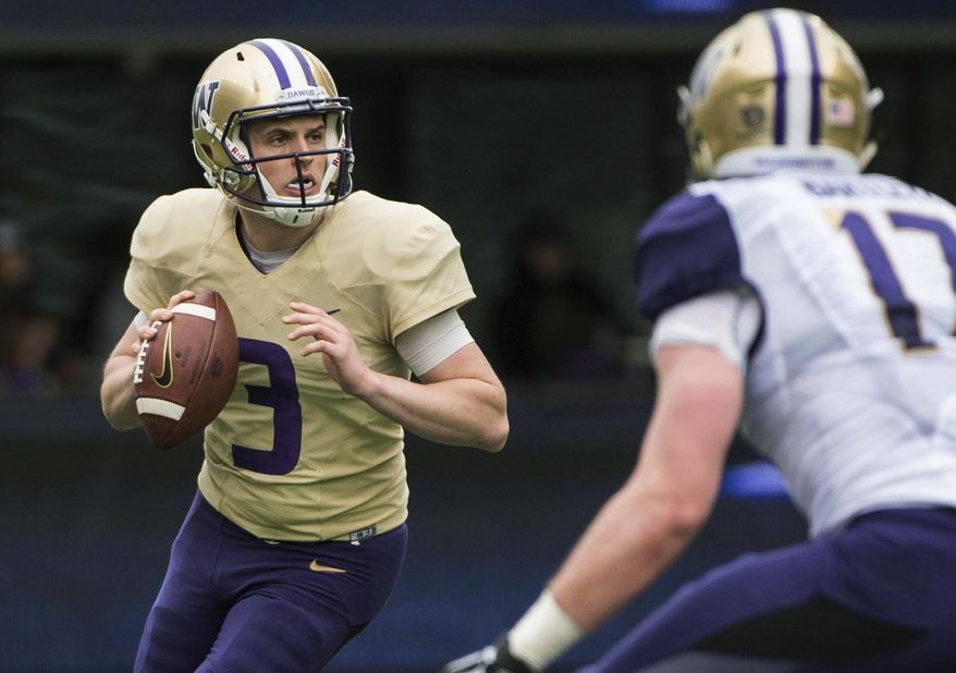 FILE - In this April 22, 2017, file photo, Washington quarterback Jake Browning (3) looks to pass during the NCAA college football team's spring game at Husky Stadium, in Seattle. It took Chris Petersen all of three years to put Washington back in the national conversation. Now, stay there. (Joshua Bessex/The News Tribune via AP, File)