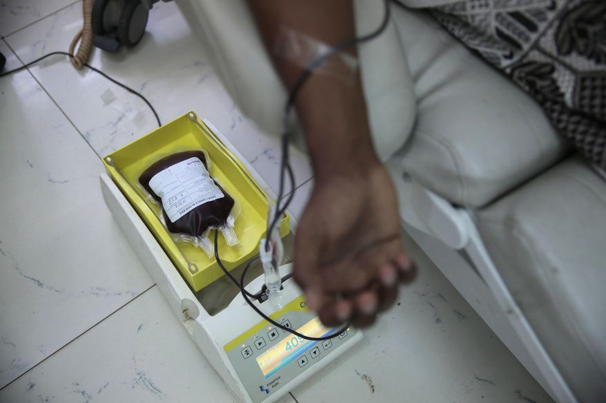 A man donates blood in National Blood Transfusion and Research Centre in Sanaa, Yemen, Wednesday, Aug. 9, 2017. The director of Yemen's national blood bank says the facility could shut down within a week after a medical aid charity ended its support. Ayman el-Shihari, the blood bank's general director, said Thursday its closure could lead to a "humanitarian catastrophe." (AP Photo/Hani Mohammed)