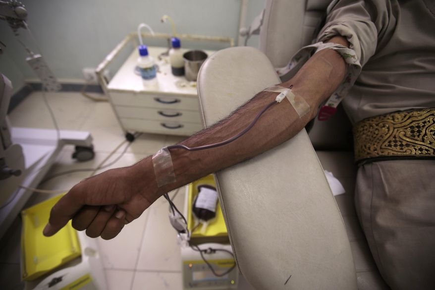 A man donates blood in National Blood Transfusion and Research Centre in Sanaa, Yemen, Wednesday, Aug. 9, 2017. The director of Yemen's national blood bank says the facility could shut down within a week after a medical aid charity ended its support. Ayman el-Shihari, the blood bank's general director, said Thursday its closure could lead to a "humanitarian catastrophe." (AP Photo/Hani Mohammed)