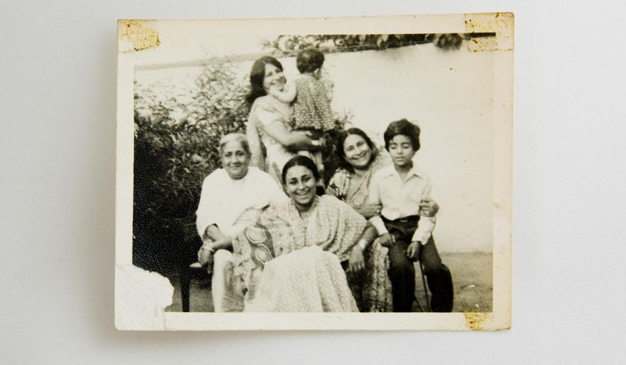 This late 1970&#x27;s photo from the Naqvi &amp;amp; Zaidi family album shows Fahmida Hasan Zaidi, second right, with her mother Alamdari Begum, left, daughter Kahkashan Naqvi, front, younger sister Khurshid Zaidi, nephew Shiraz Zaidi, right, and young AP reporter Muneeza Naqvi in Lucknow, India. Zaidi lives in New Delhi while the rest of her seven siblings live in cities across Pakistan. For them, a generation raised on the idea that relationships could be nurtured for long periods on the simple sustenance of letters, physical distance has brought pain, but not an emotional distance. (AP Photo/Bernat Armangue)
