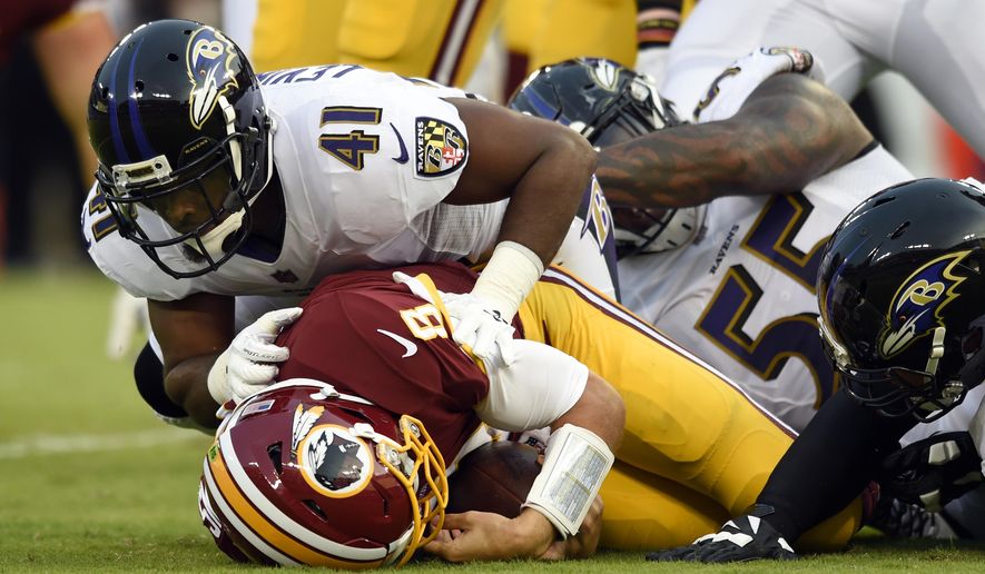 Baltimore Ravens cornerback Anthony Levine (41) sacks Washington Redskins quarterback Kirk Cousins in the first half of a preseason NFL football game, Thursday, Aug. 10, 2017, in Baltimore. (AP Photo/Gail Burton)