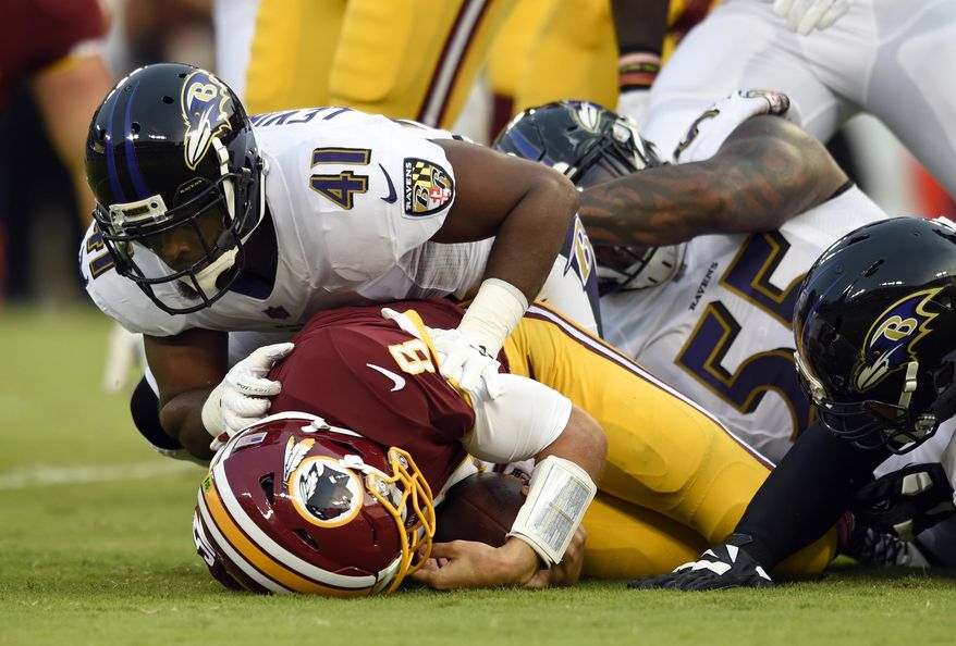 Baltimore Ravens cornerback Anthony Levine (41) sacks Washington Redskins quarterback Kirk Cousins in the first half of a preseason NFL football game, Thursday, Aug. 10, 2017, in Baltimore. (AP Photo/Gail Burton)