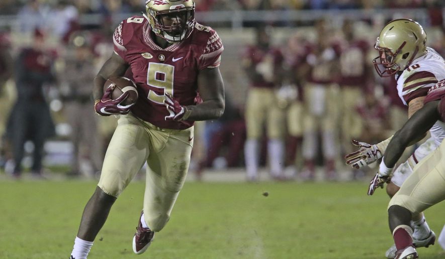 FILE - This Nov. 11, 2016 photo shows Florida State's Jacques Patrick looking for running room against Boston College's defense in an NCAA college football game in Tallahassee, Fla. After two years of being behind Dalvin Cook on the depth chart, Jacques Patrick is ready to take the lessons he learned from watching Cook and become Florida State's lead running back this season. (AP Photo/Steve Cannon)