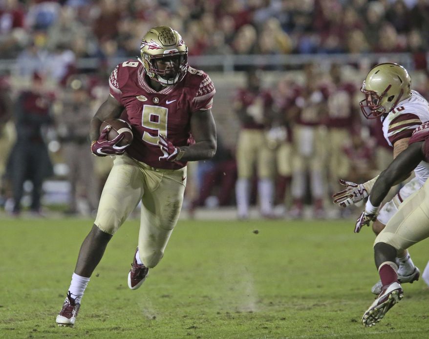 FILE - This Nov. 11, 2016 photo shows Florida State's Jacques Patrick looking for running room against Boston College's defense in an NCAA college football game in Tallahassee, Fla. After two years of being behind Dalvin Cook on the depth chart, Jacques Patrick is ready to take the lessons he learned from watching Cook and become Florida State's lead running back this season. (AP Photo/Steve Cannon)