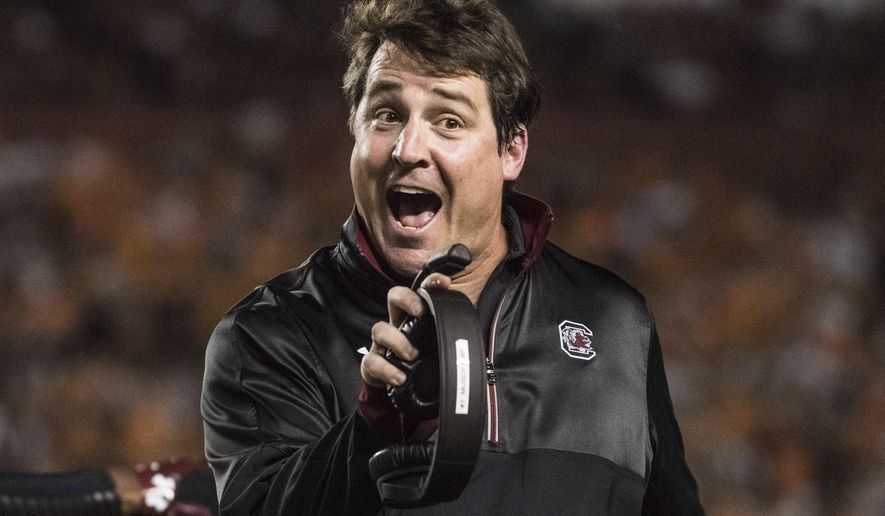 FILE - In this Oct. 29, 2016, file photo, South Carolina head coach Will Muschamp communicates with a referee during the first half of an NCAA college football game against Tennessee, in Columbia, S.C. South Carolina coach Will Muschamp boiled his team's problems last year to two things: Running successfully and stopping the run. (AP Photo/Sean Rayford, File)