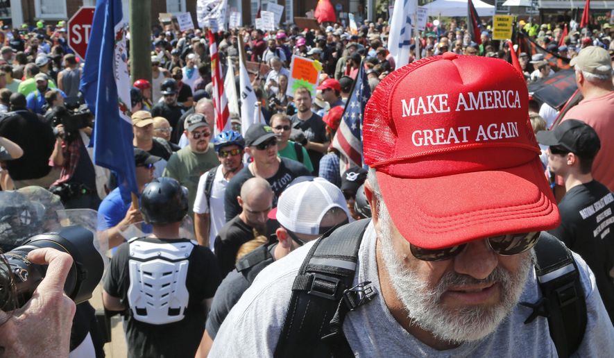 Some white nationalist groups praised President Trump's remarks Saturday and said they amounted to a victory because they didn't explicitly blame anyone for the violence. (Associated Press/File)