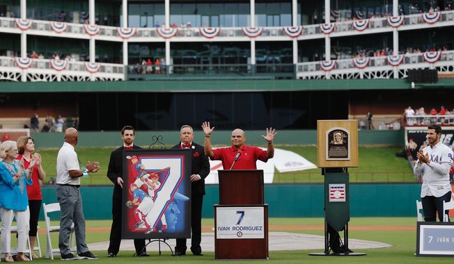 Former Texas Rangers player Ivan Rodriguez speaks during a ceremony to retire his number before a baseball game against the Houston Astros, Saturday, Aug. 12, 2017, in Arlington, Texas. (AP Photo/Brandon Wade)