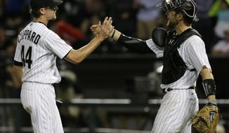 Chicago White Sox closer Tyler Clippard, left, celebrates with catcher Kevan Smith after they defeated the Kansas City Royals in a baseball game Friday, Aug. 11, 2017, in Chicago. (AP Photo/Nam Y. Huh)