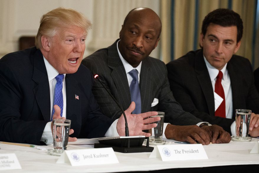 In this Thursday, Feb. 23, 2017, file photo, President Donald Trump, left, speaks during a meeting with manufacturing executives at the White House in Washington, including Merck CEO Kenneth Frazier, center, and Ford CEO Mark Fields. Frazier is resigning from the President’s American Manufacturing Council citing &quot;a responsibility to take a stand against intolerance and extremism.&quot; Frazier&#x27;s resignation comes shortly after a violent confrontation between white supremacists and protesters in Charlottesville, Va. Trump is being criticized for not explicitly condemning the white nationalists who marched in Charlottesville. (AP Photo/Evan Vucci, File)