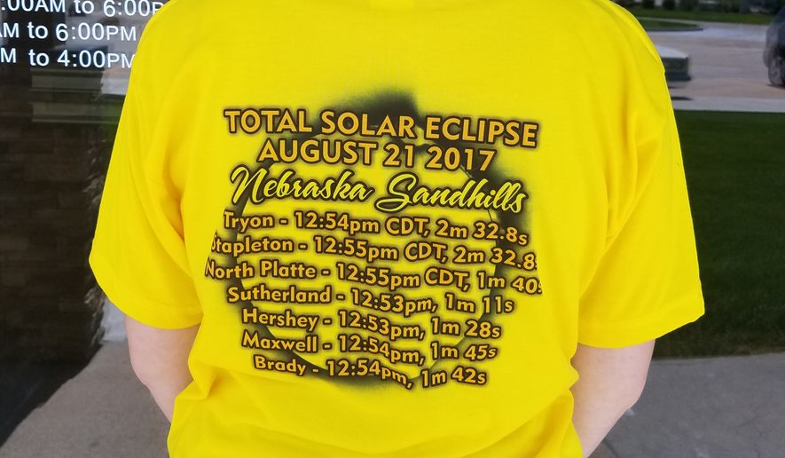 Amanda Connick of North Platte, Nebraska, sports a T-shirt advertising the best times and locations for eclipse-viewing on the Nebraska Sandhills. (Valerie Richardson/The Washington Times)