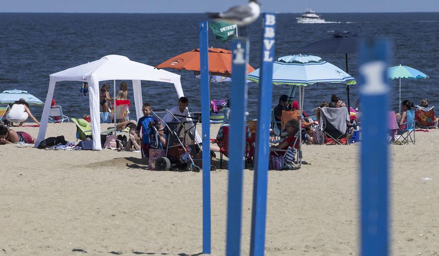 Tents and canopies set up on the beach in Belmar, N.J., Wednesday, Aug. 9, 2017. Locals say that they welcome the Belmar Borough Council's recent proposal to ban the use of such tents and canopies — a practice known as "beach spreading." (Doug Hood /The Asbury Park Press via AP)