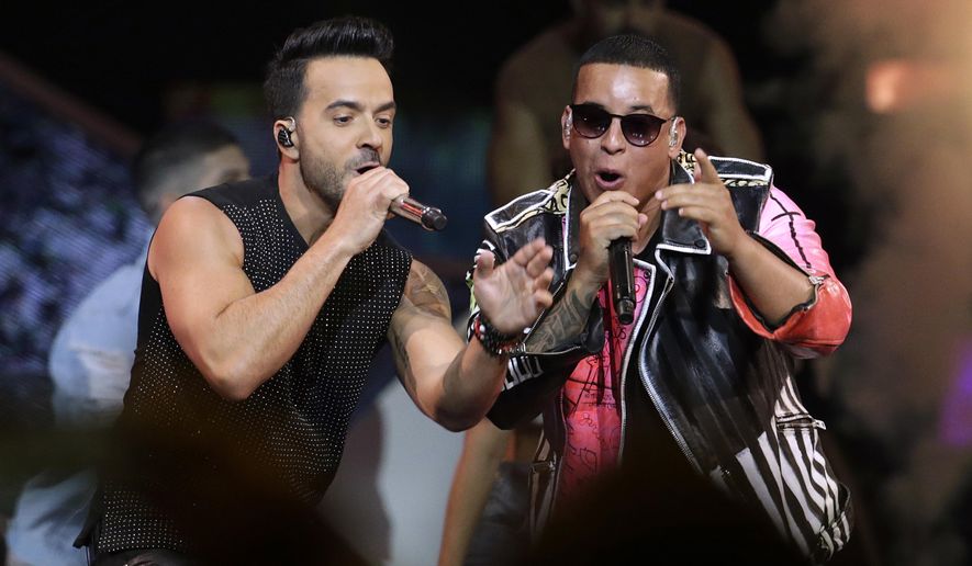 FILE - This April 27, 2017, file photo shows singers Luis Fonsi, left, and Daddy Yankee during the Latin Billboard Awards in Coral Gables, Fla. An MTV spokesperson said in a statement to The Associated Press on Monday, Aug. 14, 2017, that the ‘Despacito’ video was not submitted for consideration for nomination at the 2017 Video Music Awards. The hit song’s video has not aired on MTV or MTV2, but is being played on MTV Tres, the company’s Latin channel. Universal Music Latin Entertainment, the label that released Luis Fonsi and Daddy Yankee’s “Despacito,” said they welcome MTV to play Spanish videos on its main channel in a statement to the AP. (AP Photo/Lynne Sladky, File)