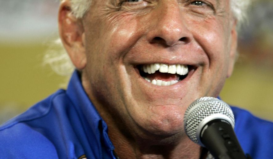 FILE - In this Sept. 22, 2007, file photo, wrestler Ric Flair addresses the media during a news conference at Dover International Speedway in Dover, Del. Flair&#39;s representative said on Twitter Aug. 14, 2017, that Flair was dealing with some &amp;quot;tough medical issues.&amp;quot; (AP Photo/Carolyn Kaster, File)