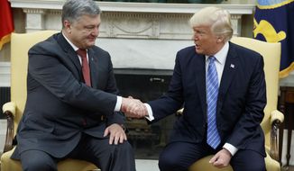 In this June 20, 2017, photo, President Donald Trump shakes hands with Ukrainian President Petro Poroshenko during a meeting in the Oval Office of the White House in Washington. Seeking leverage with Russia, the Trump administration has reopened consideration of long-rejected plans to give Ukraine lethal weapons, even if that would plunge the United States deeper into the former Soviet republic’s conflict. (AP Photo/Evan Vucci, File)