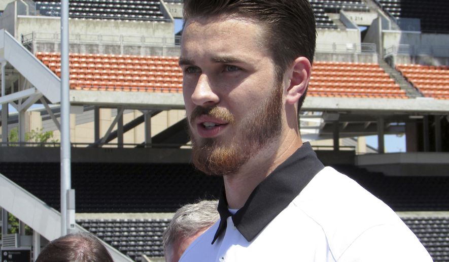 Oregon State quarterback Jake Luton speaks to reporters at Reser Stadium in Corvallis, Ore., on Tuesday, July 18, 2017, before the start of fall camp. Luton has been named the Beavers’ starter for the upcoming season. (AP Photo/Anne M. Peterson)